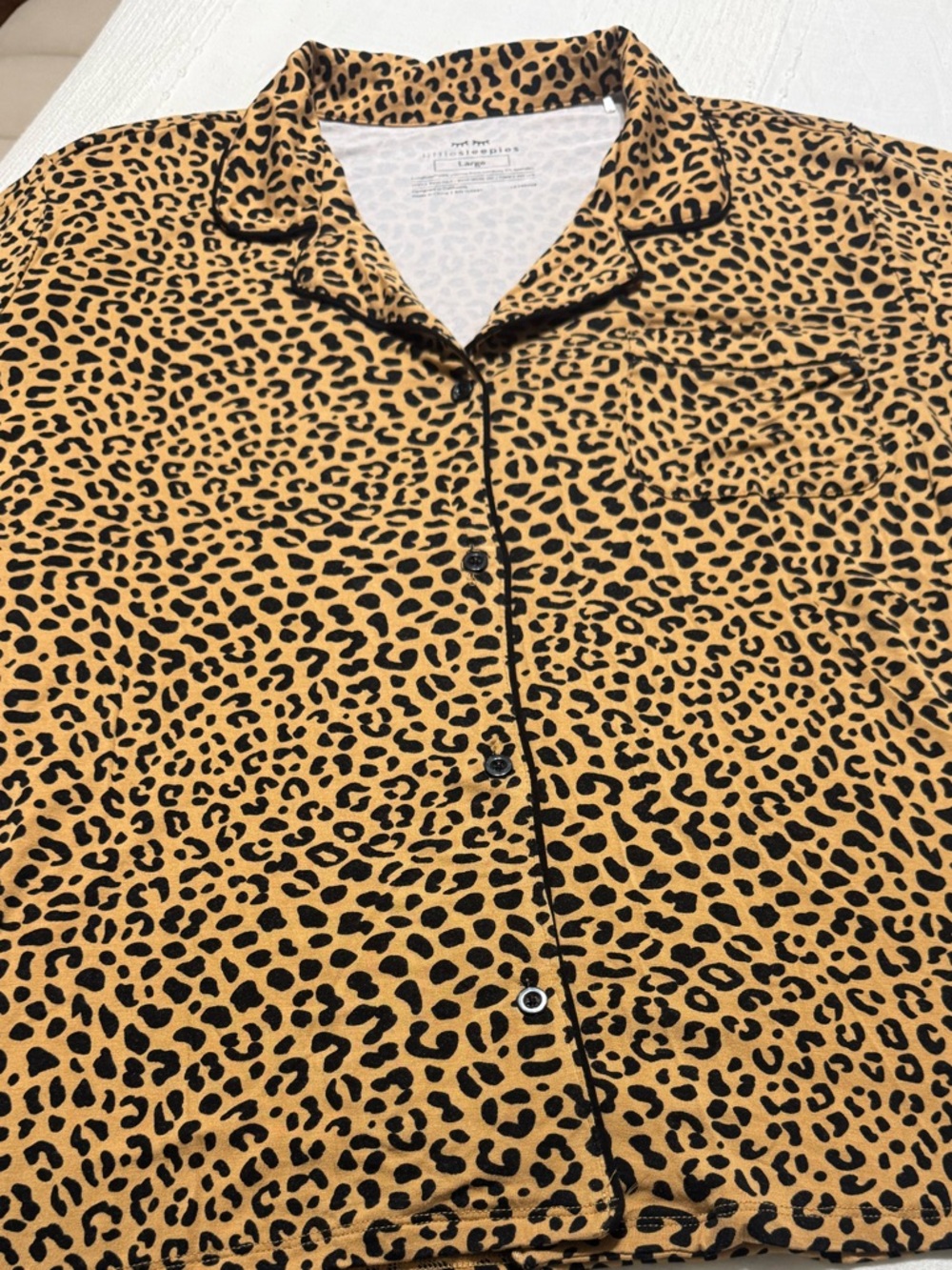 Women’s Little Sleepies Leopard Print Button-Up Top with matching pajama shorts